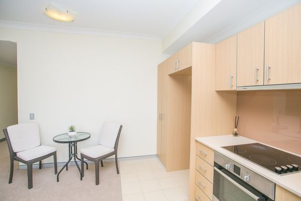 LOW MAINTENANCE SECURE APARTMENT IN PERFECT LOCATION - Photo 1