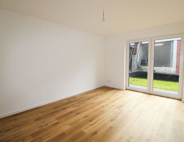 ERSTBEZUG! EG-Wohnung mit überdachtem Stellplatz und ca. 103m²! - Photo 1