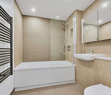 Modern two-bedroom apartment with open-plan living, a private balcony, contemporary finishes and access to a communal roof terrace. - Photo 4