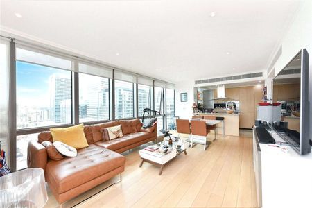 Offered this superb two bedroom apartment, positioned in one of Canary Wharfs most desirable residential developments. - Photo 2