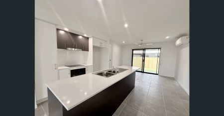 Brand New 4 Bedroom Home in a Prime Location! - Photo 2