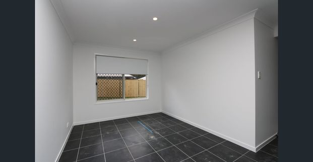 Modern 3 Bedroom Home with Large Backyard (Break Lease) - Photo 1