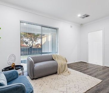 Impressive Stylish Four Bedroom Home in Perfect Location! - Photo 1