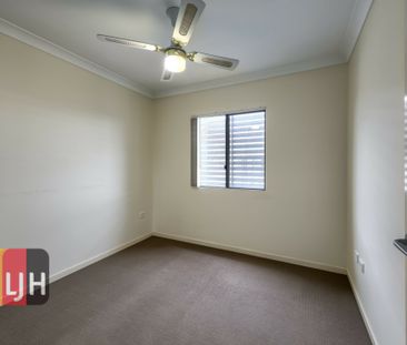 TOP FLOOR THREE BEDROOM UNIT WITH DOUBLE GARAGE & LARGE DECK! - Photo 6