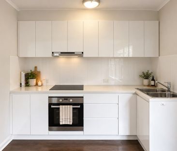 Unfurnished Downstairs One-Bedroom Apartment in Ultra-Convenient Lo... - Photo 2