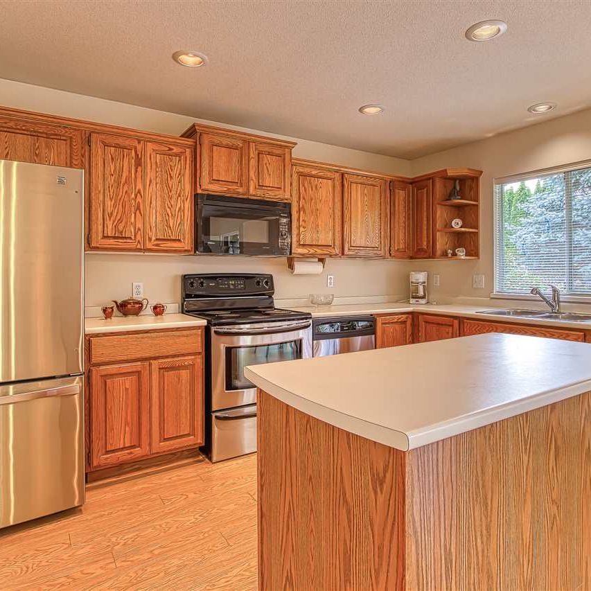 Beautifully Kept Three Bedrooms/Two Bath Home in Fraser Heights - Photo 1