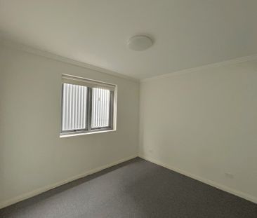 Brand new carpet, three bright rooms with windows, and two parking ... - Photo 4