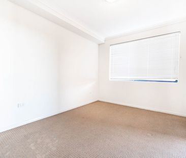 Well presented 2-bedroom unit - Photo 2