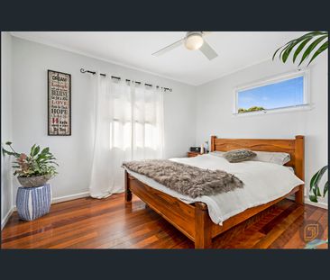 Flawlessly Renovated Family Haven with Dual-Level Flexibility - Photo 4