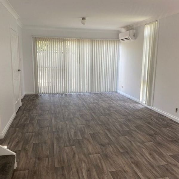 Two Bedroom Townhouse in Ideal Location - Photo 1