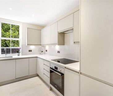 A recently renovated two bedroom fourth floor apartment benefitting from direct lift access, views of the communal gardens and a brand new kitchen. - Photo 1