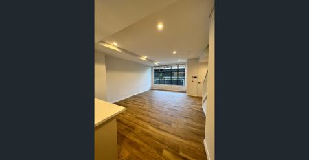 Near new, split level, spacious two bedroom, two bathroom apartment in quiet location only metres from Homebush Train Station - Photo 2