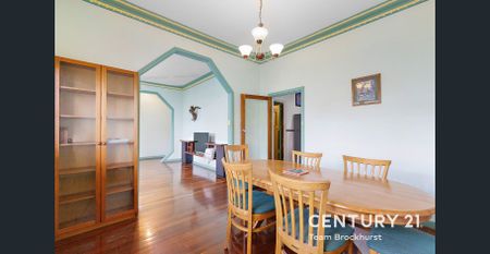 Charming 1950s Home with Modern Flexibility & Pristine Gardens! - Photo 4