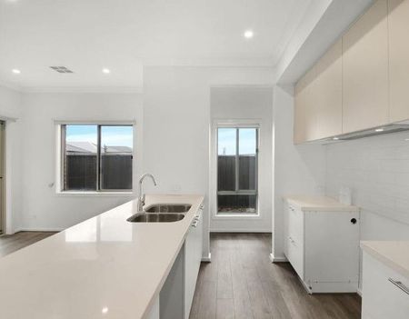 Modern Comforts Await in This 4-Bedroom, 2-Bathroom Home - Photo 2