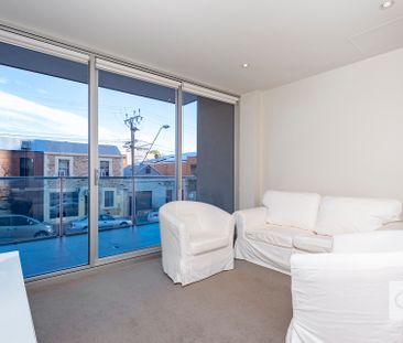 Open the Door to Effortless City Living with Stylish Furnished Comfort - Photo 3