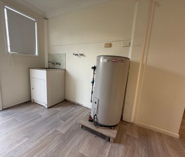 Neat and Tidy High Set with Fresh Pain and Flooring - Photo 2