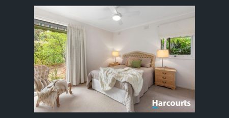 Elegant Brick Home with Serene Garden Surrounds - Photo 5