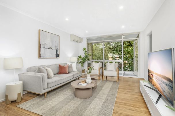 Renovated Three-Bedroom Retreat in Ultra Convenient Location Moments from Everything - Photo 1