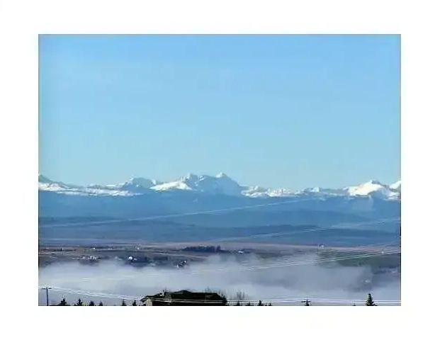 Executive Townhome w beautiful Mountain View! full Gym, 2 Indoor parking, & A/C | 148 Rockyledge View NW, Calgary - Photo 1