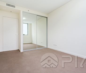 AS NEW THREE BEDROOM APARTMENT WITH TWO CAR SPACES! - Photo 2