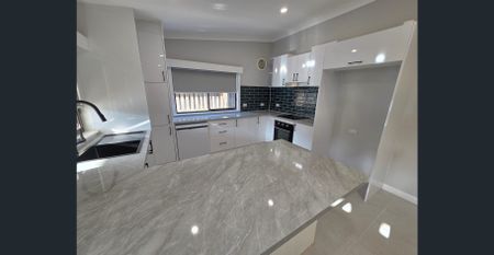 Luxuriously renovated home with landscaped gardens & security system - Photo 3