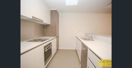 Top Floor Executive Apartment : Shopping Strip Location - Photo 3