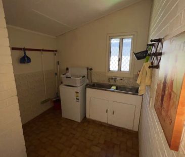 “Charming 2-Bedroom Home with Sunroom and Lovely Gardens” - Photo 1