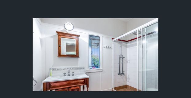 Renovated Highset Queenslander with Deck & Dual Living Areas - Moments From The Waterfront - Photo 1