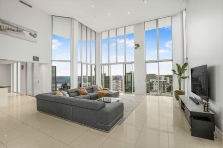 Luxurious Multi-Level Penthouse with Private Rooftop Jacuzzi & Panoramic Views - Photo 3