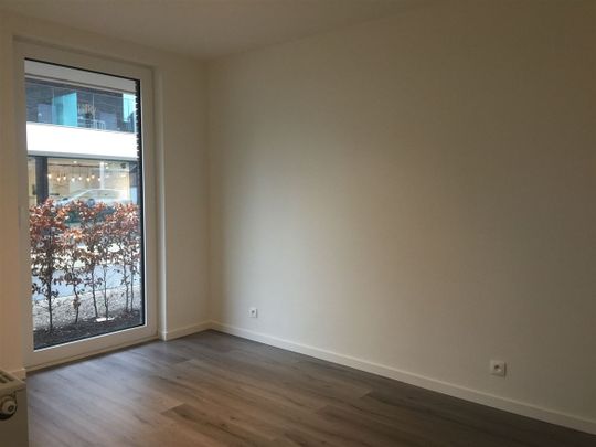 Gelijkvloers appartement met 2 slpk, terras en autostaanplaats - Foto 1