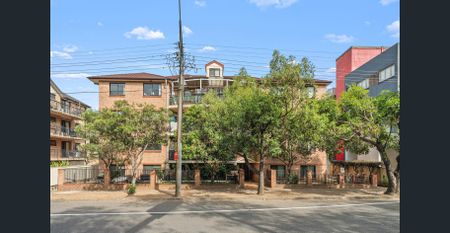 Full Brick Split-Level Unit with Fresh Paint, Modern Upgrades & A/C - Photo 5