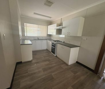 SPACIOUS FOUR BEDROOM, TWO BATHROOM HOUSE WITH 5X CARPORT - Photo 5