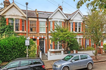 A stunning family home that has been beautifully finished through out on a desirable tree lined street in West Putney moments from the amenities of the Lower Richmond Road. - Photo 3