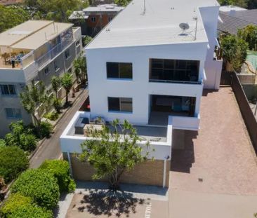 Elevated Coastal Apartment Living - Photo 2