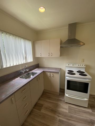 This tidy two-bedroom, one-bathroom home in Enderley offers comfortable living with an open-plan kitchen and lounge, and an internal laundry. - Photo 5
