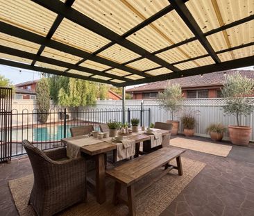 Spacious Brick Home with Inviting Pool and Expansive Outdoor Entert... - Photo 6