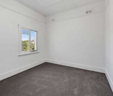 Stylish 3-Bedroom Unit with Escarpment Views & Modern Updates - Photo 1