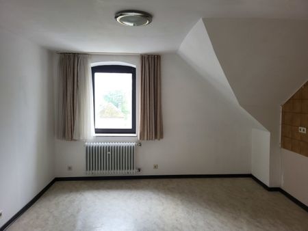 Dachgeschosswohnung mit Balkon und traumhaften Ausblick ins Grüne! - Photo 2