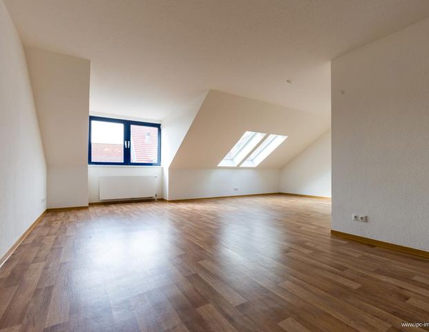 Charmante 3-Zimmer-Dachgeschosswohnung im Herzen der City - Foto 1