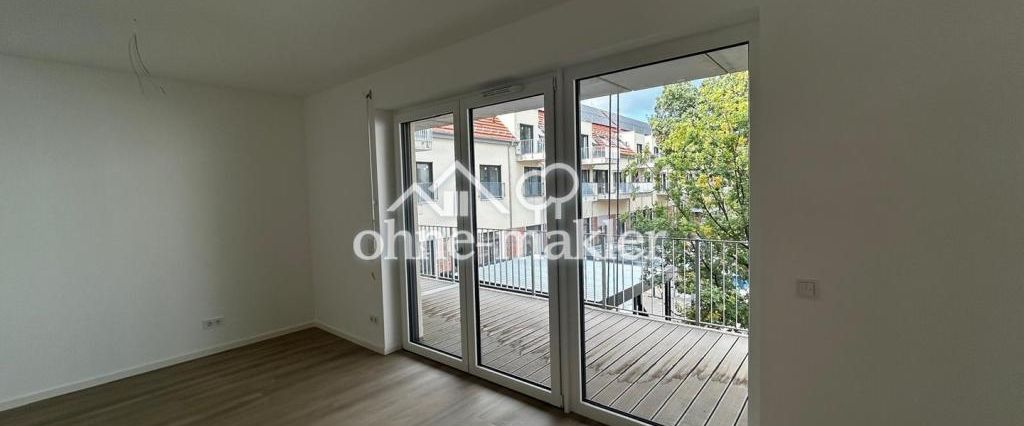 **Neubau** Charmante 2-Zimmer-Wohnung mit Einbauküche und Balkon - Foto 1