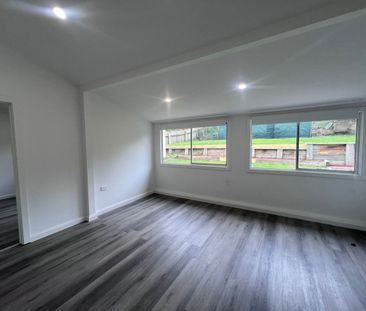 Spacious 3-Bedroom Home with Sunroom and Garden Shed - Photo 1