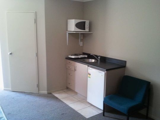 This large self contained studio room wont last long. - Photo 1