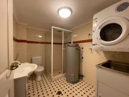 Tranquil sanctuary with lock up garage, convenient hassle-free urban living - Photo 5