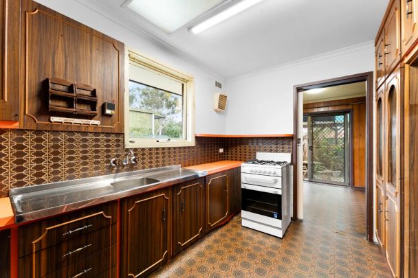 Perfectly Positioned 2-Bed Home with Entertaining Area - Photo 1