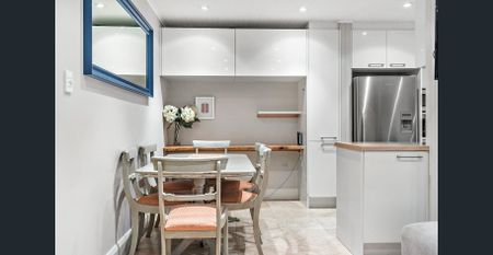 Stylish One-Bedroom Apartment Moments from the Beach - Photo 4