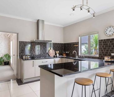 Spacious Family Living — 4 Bedrooms + Family Room + 2 Living Spaces - Photo 4