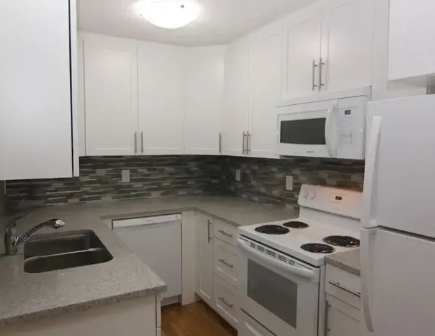 2-BR, High-grade Renovation, Old Strathcona near Whyte, University | 10150 83 Ave NW, Edmonton - Photo 1