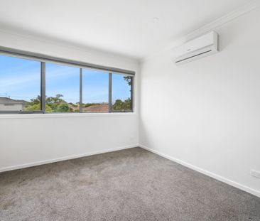 Stylish, Spacious Living with Modern Comfort Across Two Levels - Photo 1