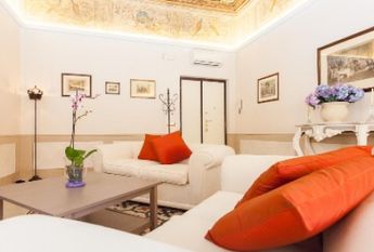 Center-Historic Jewish Quarter: Elegant apartment situated in beautiful Palazzo Nobiliare. Entrance, spacious living with original wood frescoed ceilings, large modern dining and kitchen, 4 bedrooms, 4 Baths, small terrace. #1527