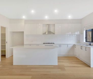 Beautifully Designed 4-Bedroom Family Home in Prime Location - Photo 6